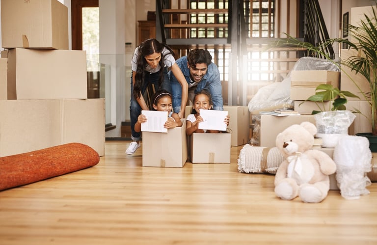 Young family having fun on moving day