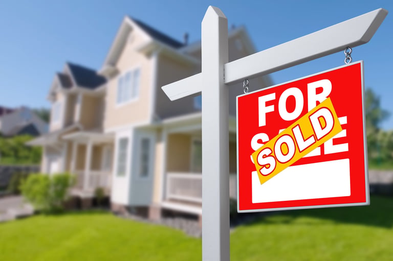 Sold Home For Sale Sign in Front of New House