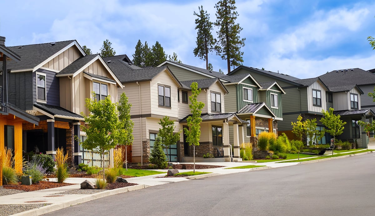Quiet neighborhood with blue sky and suburban homes